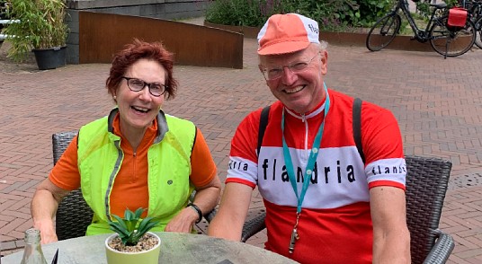 A smiling Suzie and Sietse enjoying a well deserved coffee break at a quaint Dutch cafe.